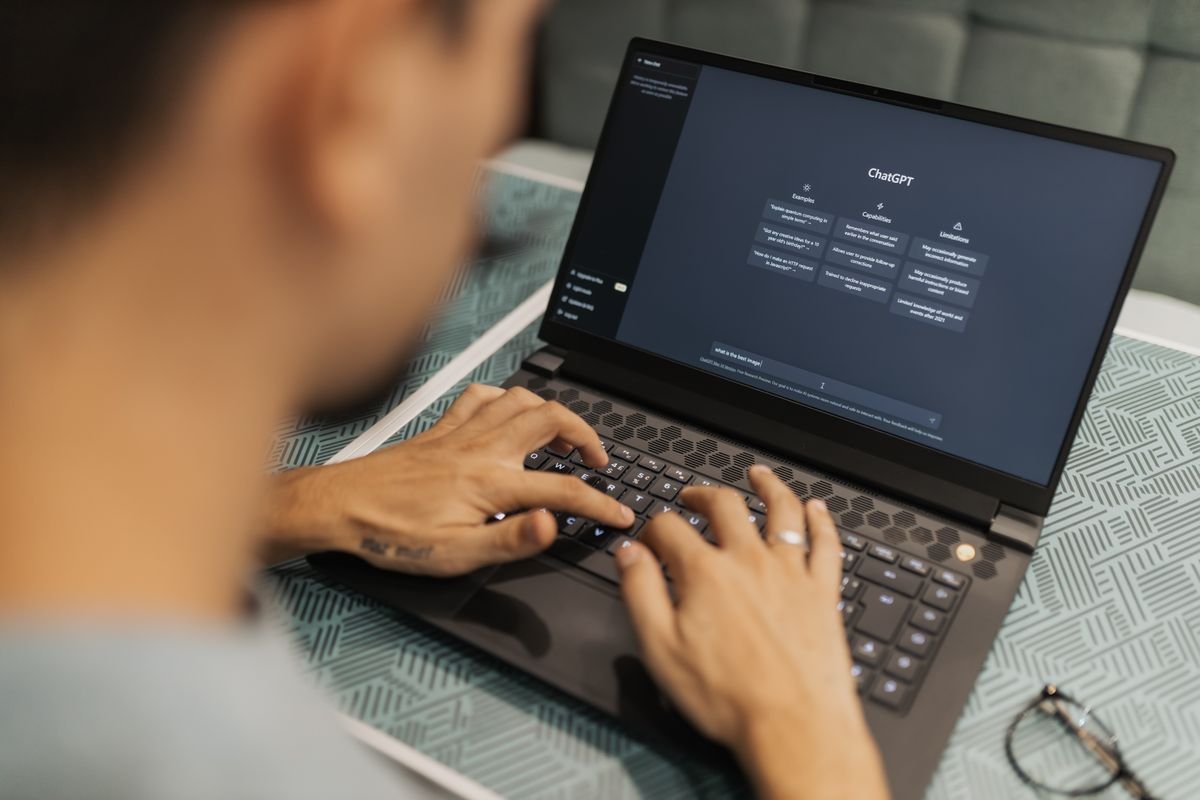 AI assistant drafting real estate social media content on a laptop