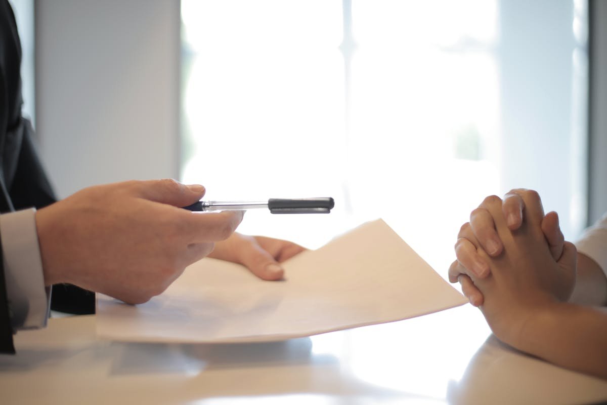 Buyer signing pre-approval documents to strengthen a home offer